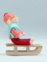 Kid Doll on Sleigh – 2.5" Handmade Felt Waldorf Doll by Ambrosius