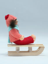 Kid Doll on Sleigh – 2.5" Handmade Felt Waldorf Doll by Ambrosius