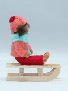 Kid Doll on Sleigh – 2.5" Handmade Felt Waldorf Doll by Ambrosius