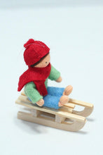 Kid Doll on Sleigh – 2.5" Handmade Felt Waldorf Doll by Ambrosius